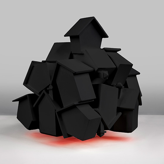 Image of artbuiec of a bunch of houses meshed together painted in balck